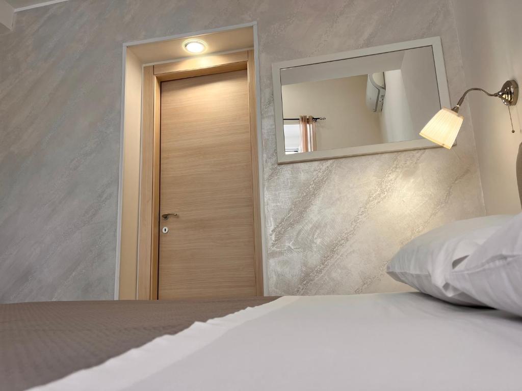 Postel nebo postele na pokoji v ubytování Esse House's Noto