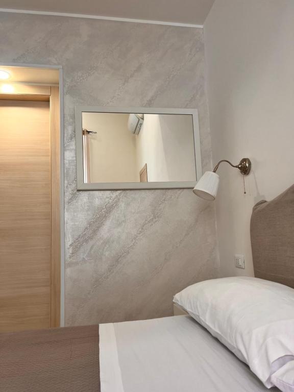 Postel nebo postele na pokoji v ubytování Esse House's Noto