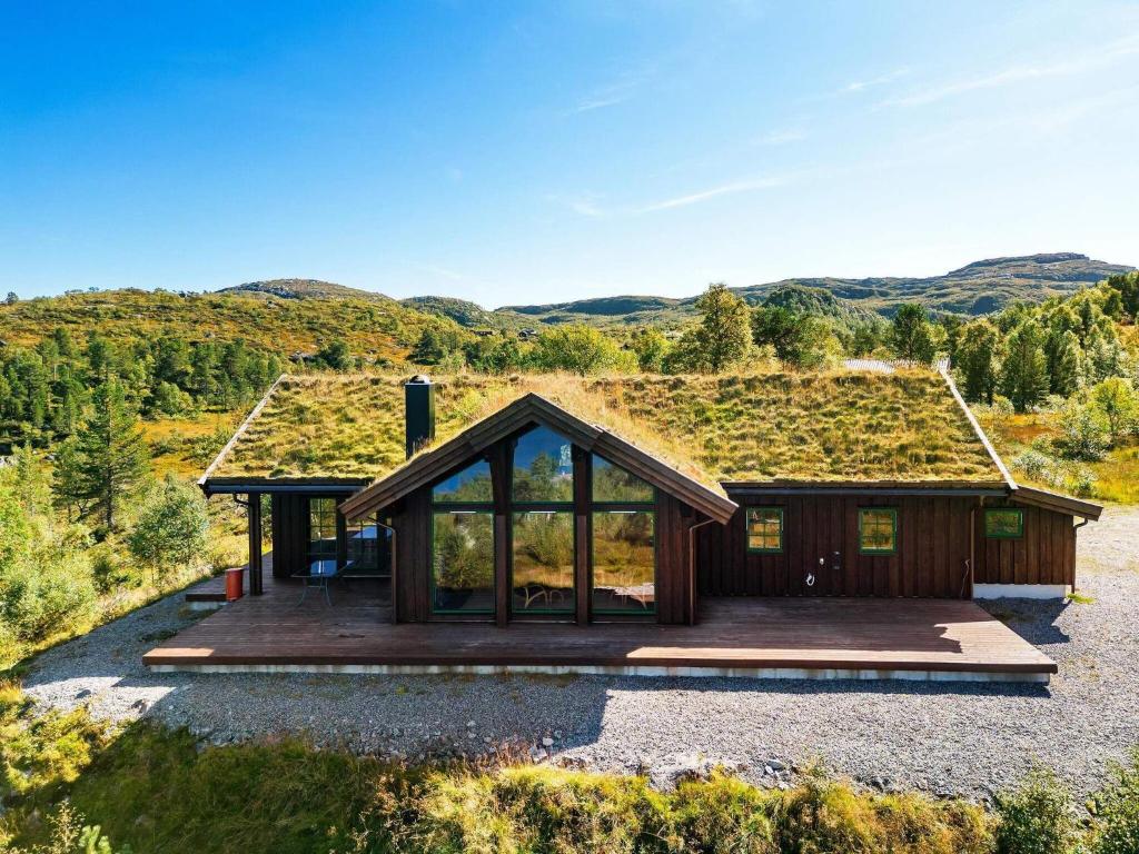 an image of a house with a grass roof at Holiday home Tjørhom II in Tjørhom