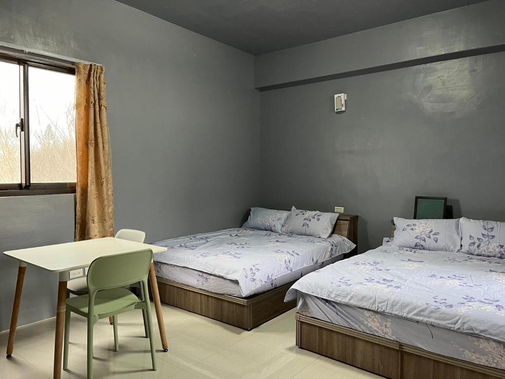 Ένα ή περισσότερα κρεβάτια σε δωμάτιο στο Sea Snail 2 B&B