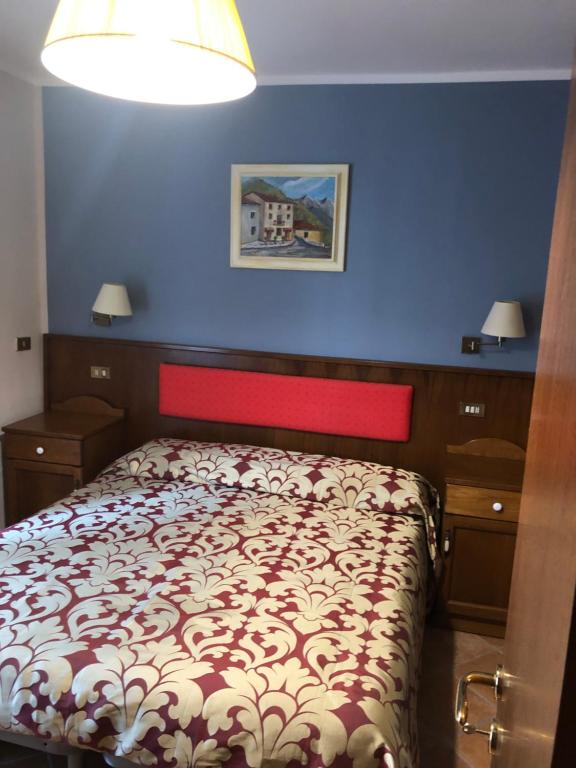 Postel nebo postele na pokoji v ubytování Albergo Miramonti