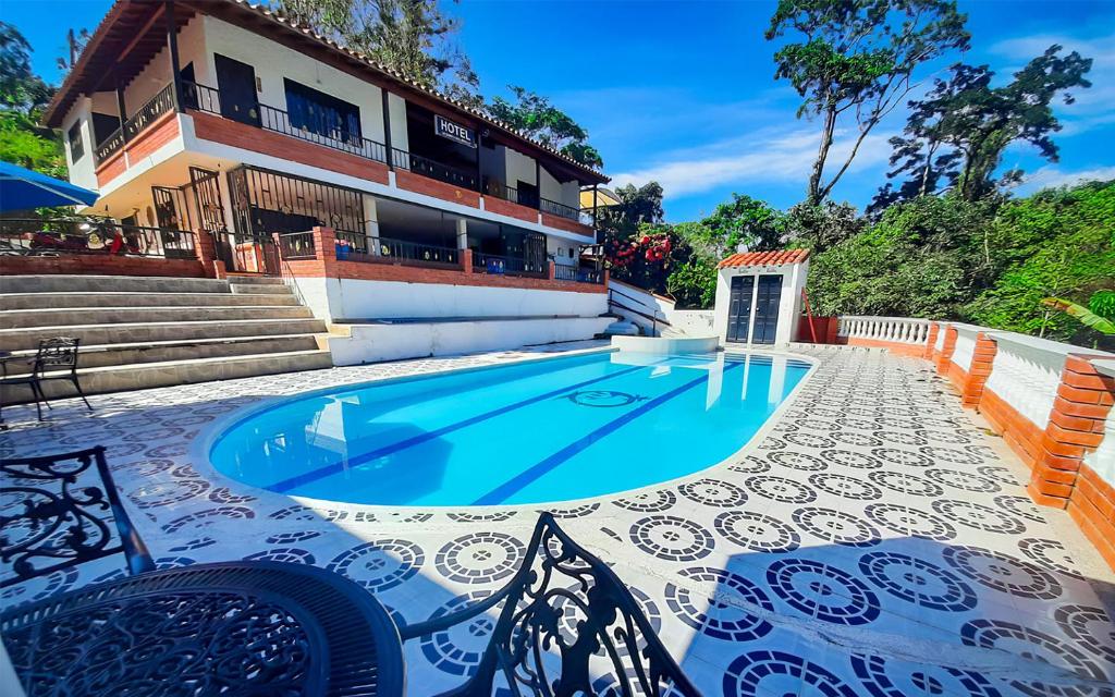 The swimming pool at or close to Hotel Campestre La Quinta del Muelle