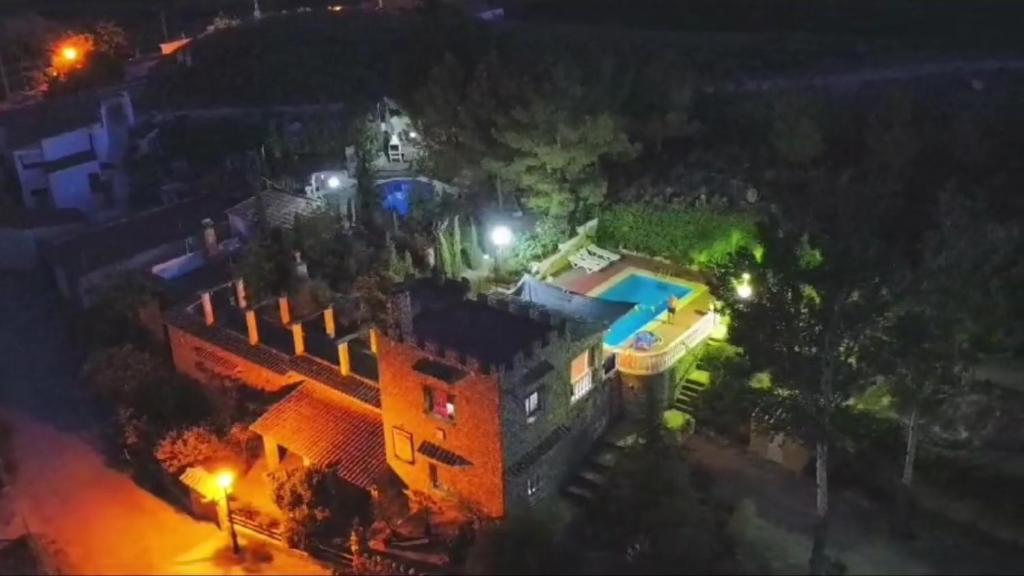 an aerial view of a house with a swimming pool at night at Cuevas del Torreón -- Nueva Dirección in Castilléjar