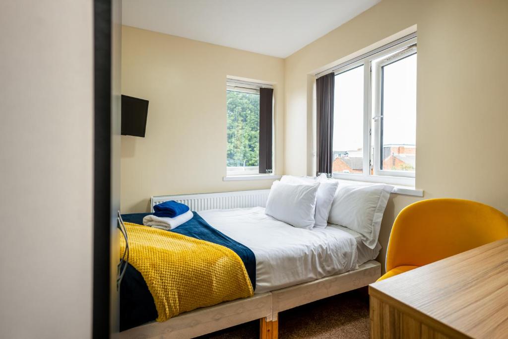 a bedroom with a bed and a window at Kunda House Rookery in Birmingham