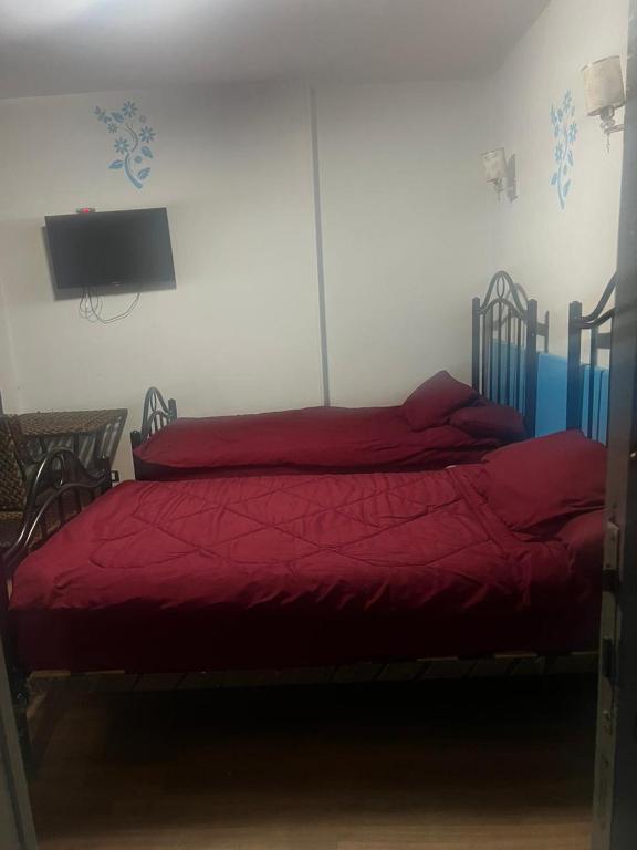 Postel nebo postele na pokoji v ubytování Al Waha Hostel