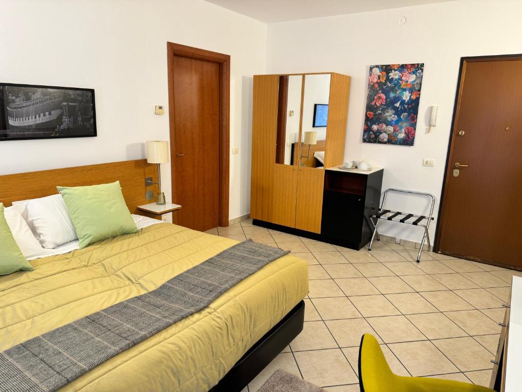 Postel nebo postele na pokoji v ubytování Residence Malpensa
