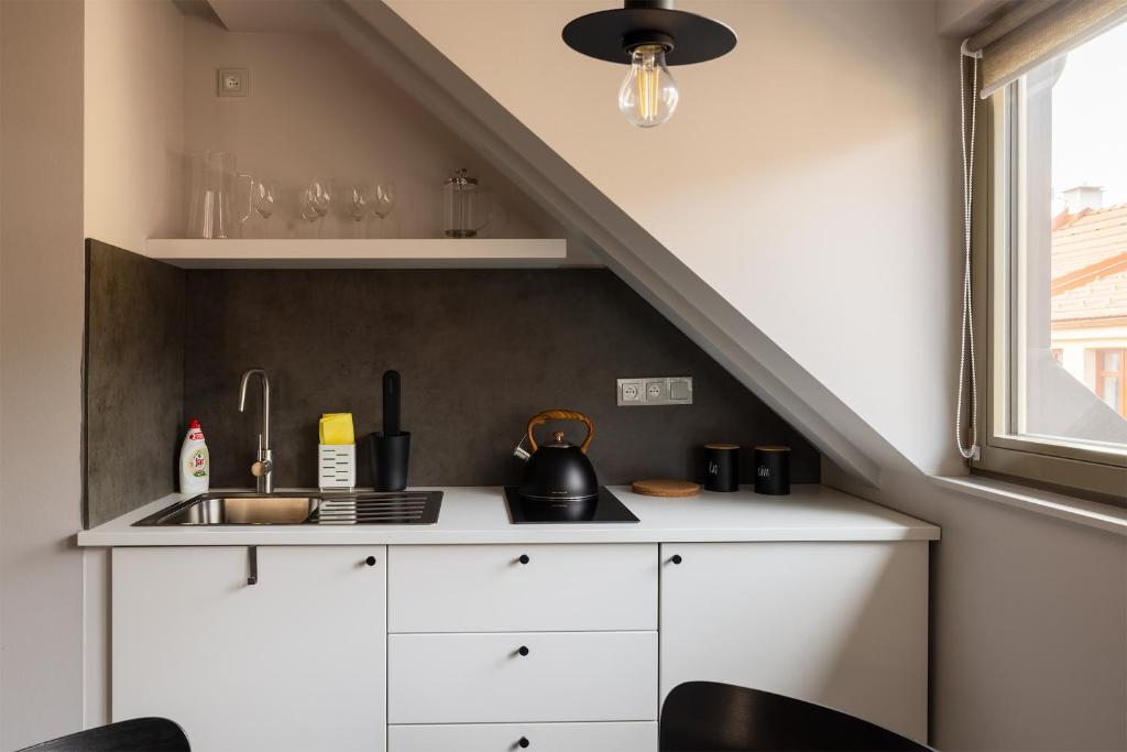 Kuchyň nebo kuchyňský kout v ubytování Apartmány v lomnickém pivovaru