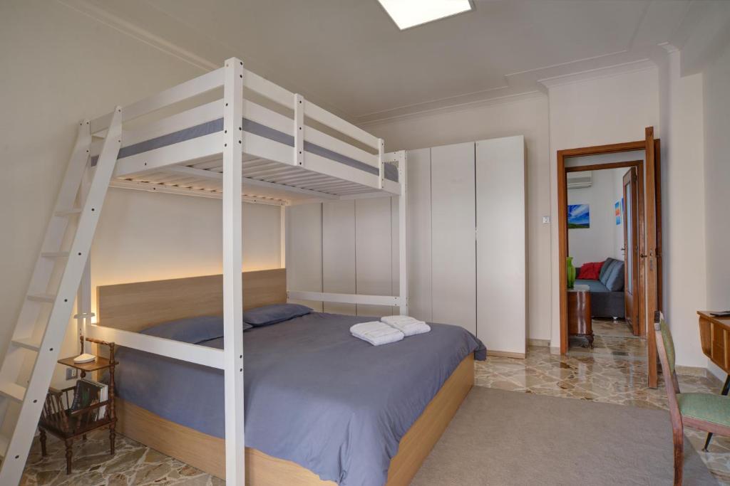 A bed or beds in a room at Top Floor Aparthotel Bentivoglio