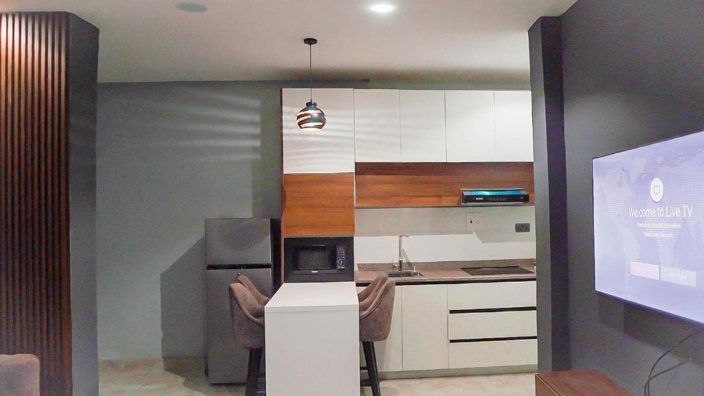 Kuchyň nebo kuchyňský kout v ubytování Cedarwood Apartments
