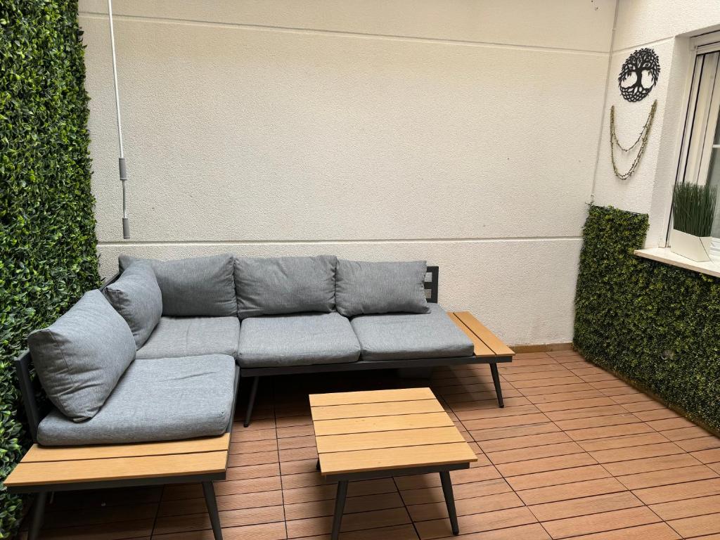 a couch sitting on top of a patio at Alojamiento Bruckner in Málaga