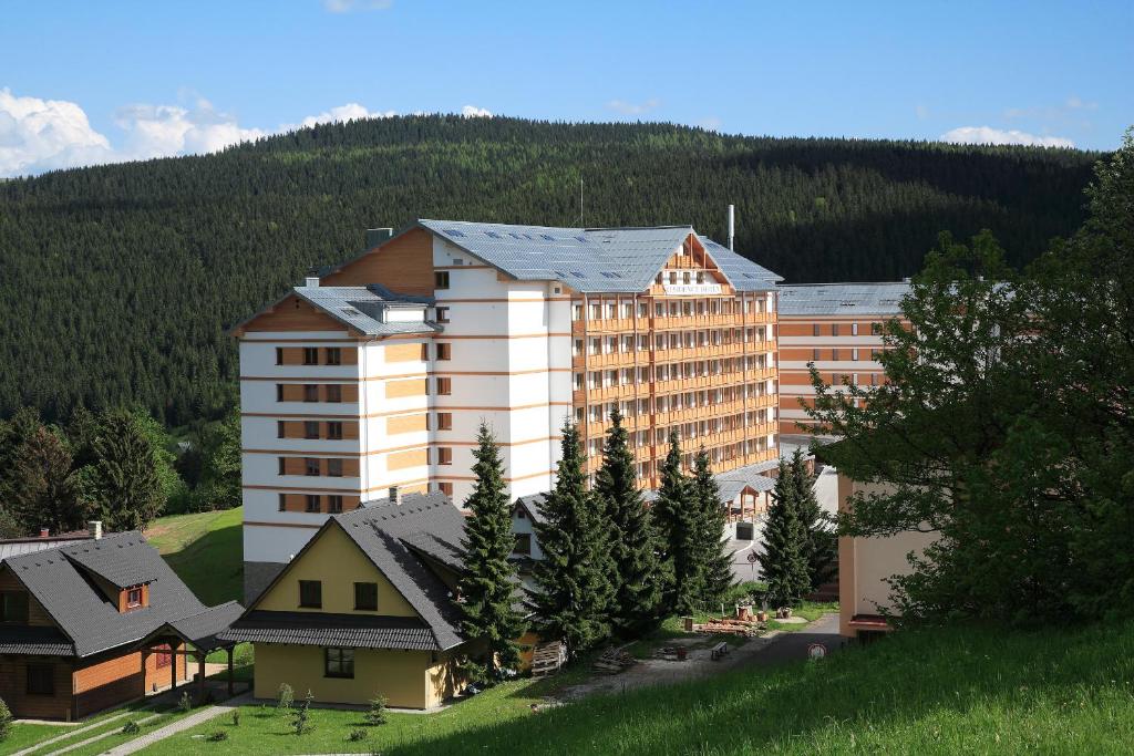 a large hotel in the middle of a mountain at Residence Hotel & Club in Donovaly