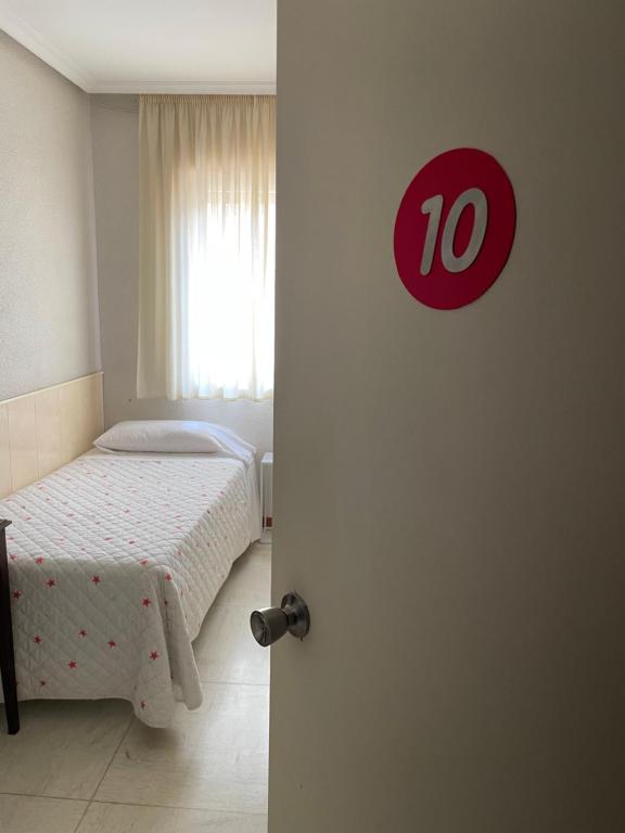 Postel nebo postele na pokoji v ubytování Hostal Ochoa