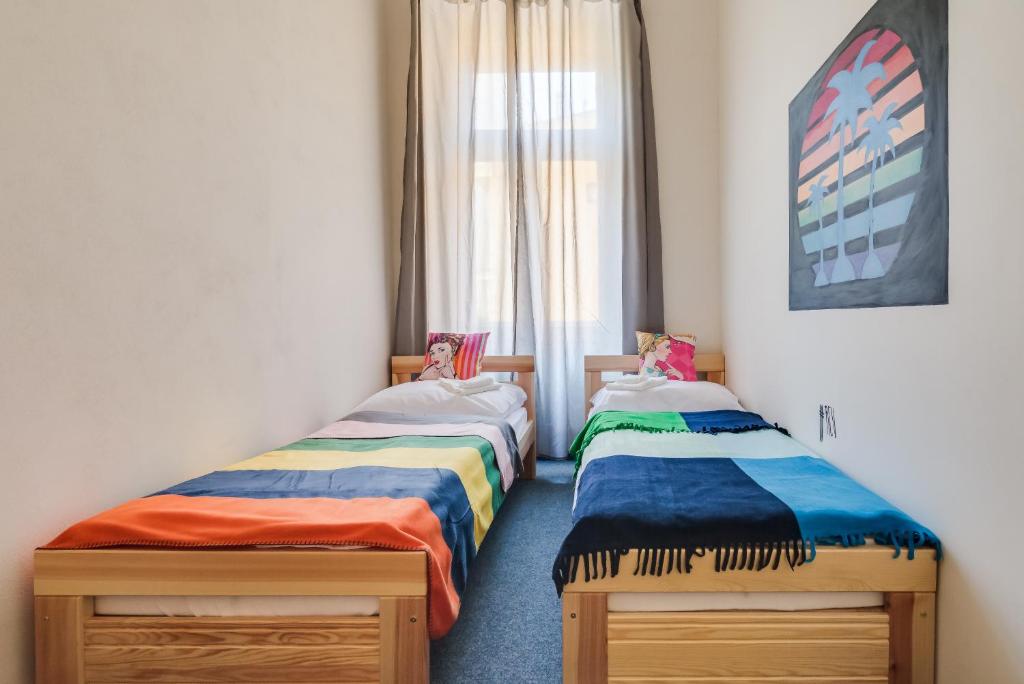Postel nebo postele na pokoji v ubytování Pop Art Rooms