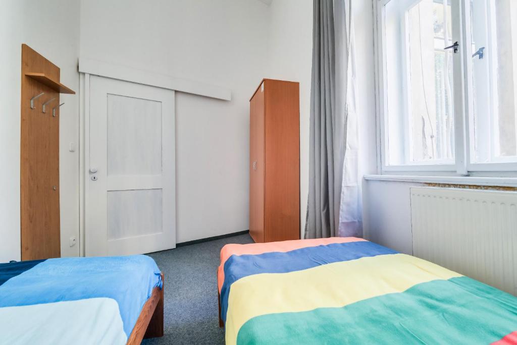 Postel nebo postele na pokoji v ubytování Pop Art Rooms
