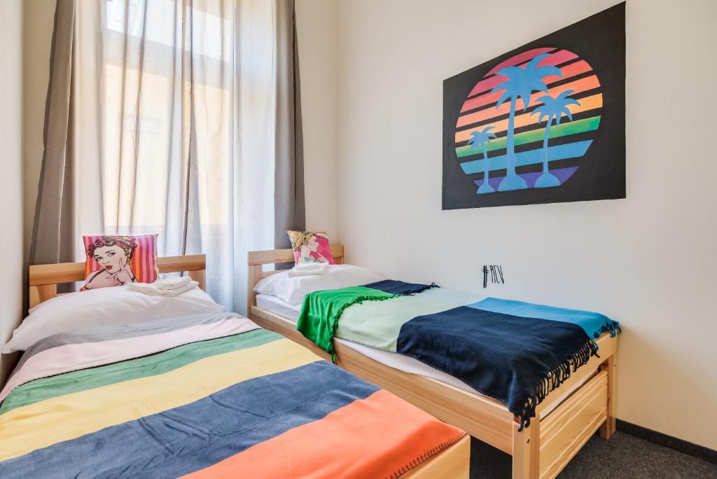 Postel nebo postele na pokoji v ubytování Pop Art Rooms