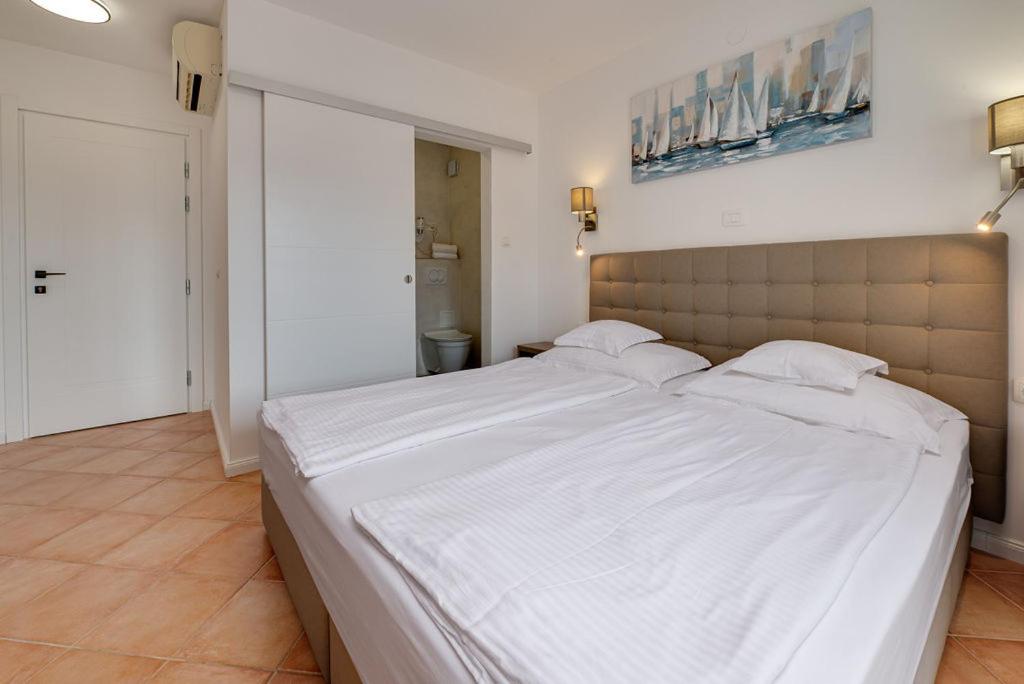 Postel nebo postele na pokoji v ubytování Bed & Breakfast Došen II