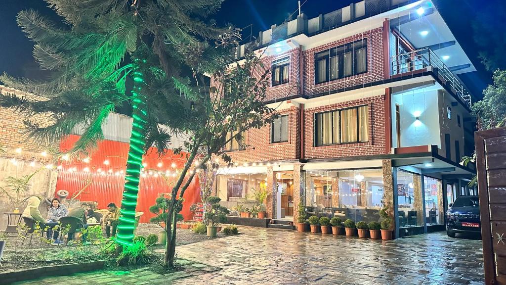a building with a christmas tree in front of it at PS Boutique Hotel in Kathmandu