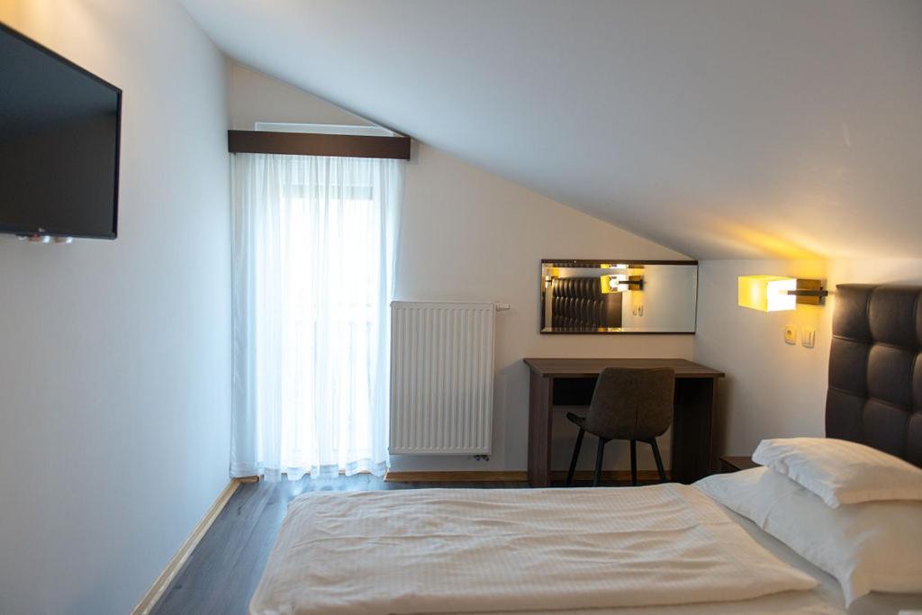 Postel nebo postele na pokoji v ubytování Bed & Breakfast Došen II