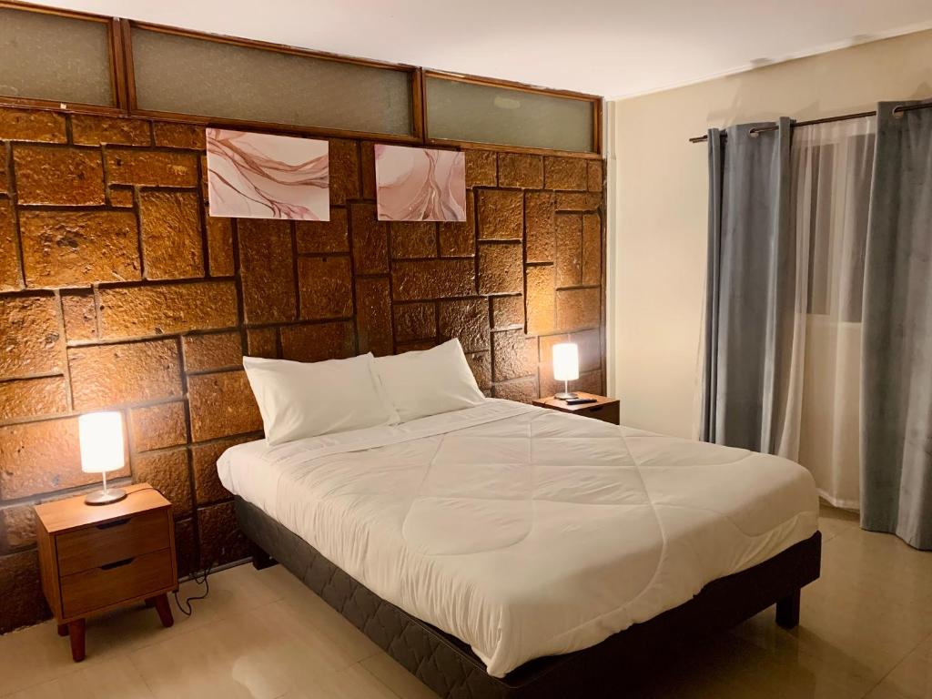 Cama o camas de una habitación en Península Hostel & Coffee