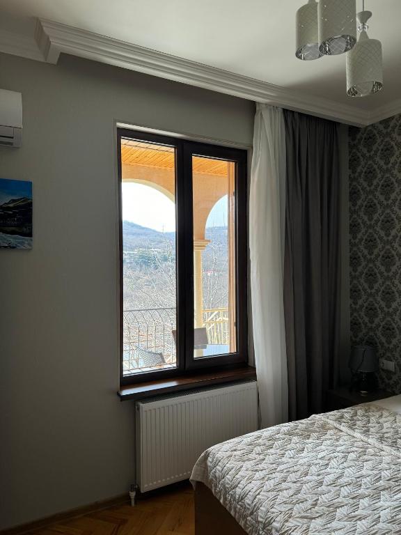 Postel nebo postele na pokoji v ubytování guest house TMT