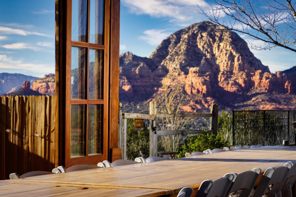 a table and chairs with a mountain in the background at Sky Ranch Lodge in Sedona