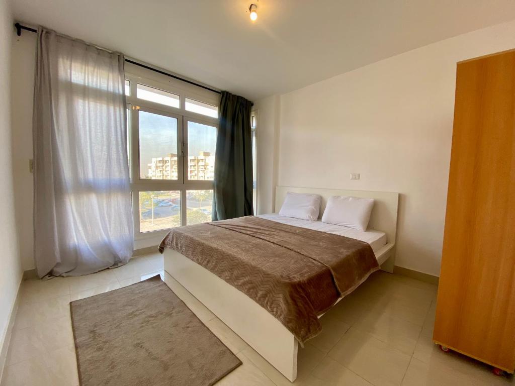 Ένα ή περισσότερα κρεβάτια σε δωμάτιο στο Apartment for Rent in Madinaty