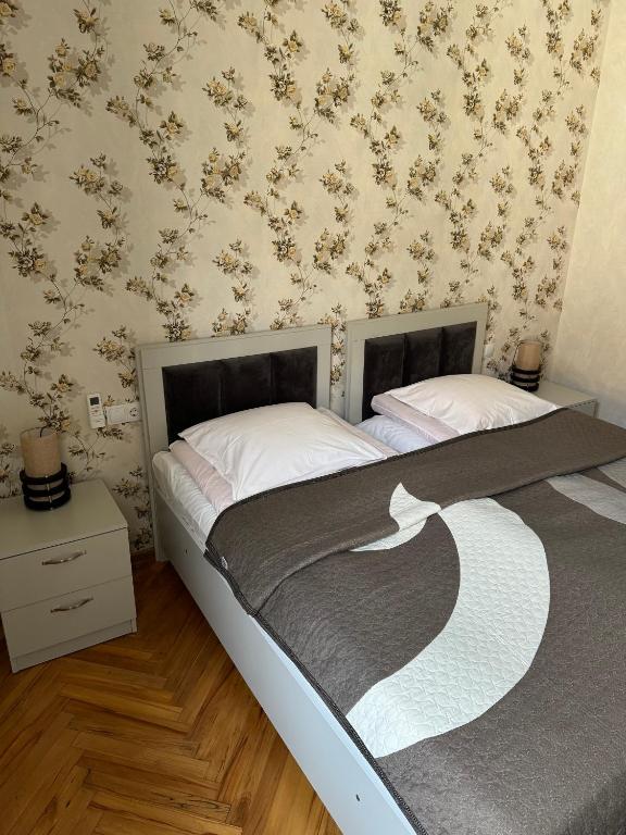 Postel nebo postele na pokoji v ubytování guest house TMT