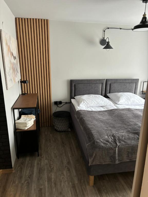 Postel nebo postele na pokoji v ubytování Guest Apartments Orłowo