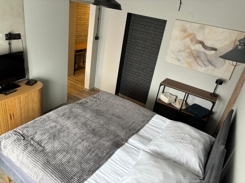 Postel nebo postele na pokoji v ubytování Guest Apartments Orłowo