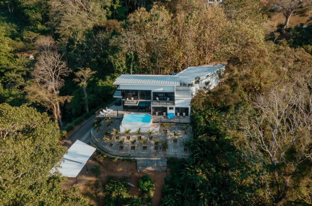 an aerial view of a house in the woods at Vida Palace in Jacó