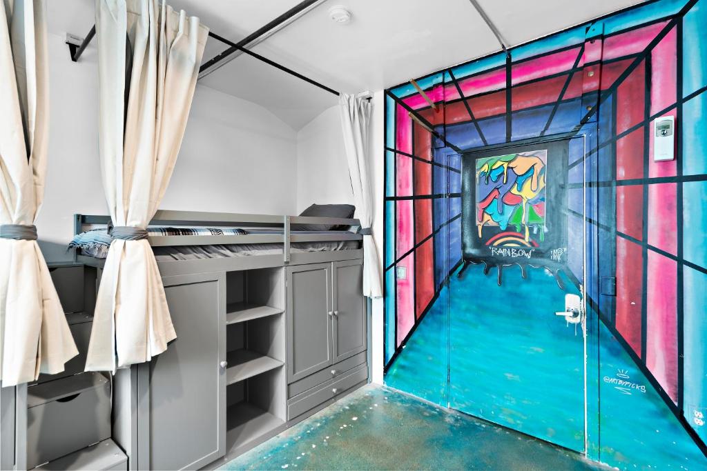 a room with a colorful stained glass window at House of Trestles in San Clemente