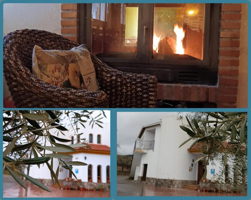 a fire in a window with a couch and a fireplace at Hotel Rural Familiar Almirez-Alpujarra in Laujar de Andarax
