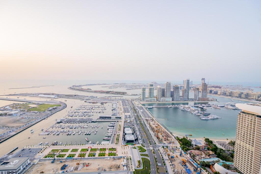 an aerial view of a city with a harbor at Vibes by Beds and Company - Room in Dubai