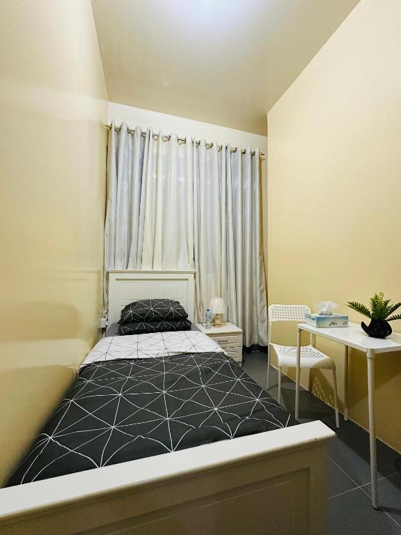 Postel nebo postele na pokoji v ubytování Sunrise Inn by DSV Property