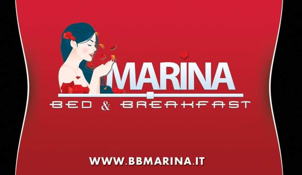 un letrero rojo que dice Marina bed and breakfast en B&B Marina, en Castro di Lecce