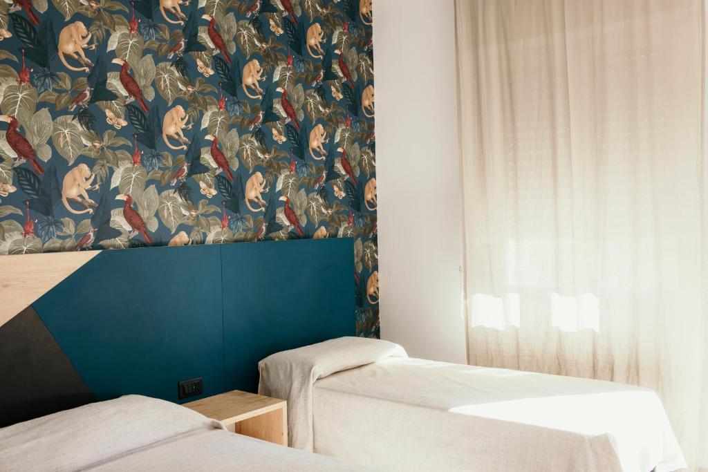 Postel nebo postele na pokoji v ubytování Hotel Acquario