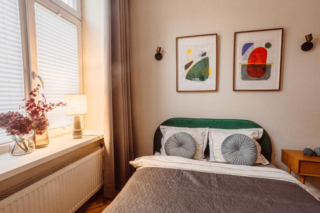 Posteľ alebo postele v izbe v ubytovaní Apartament na Krakowskim Kazimierzu