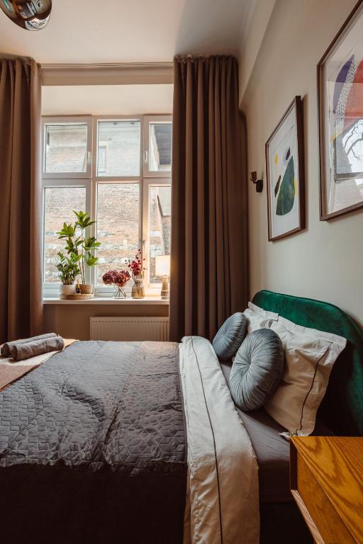 Posteľ alebo postele v izbe v ubytovaní Apartament na Krakowskim Kazimierzu