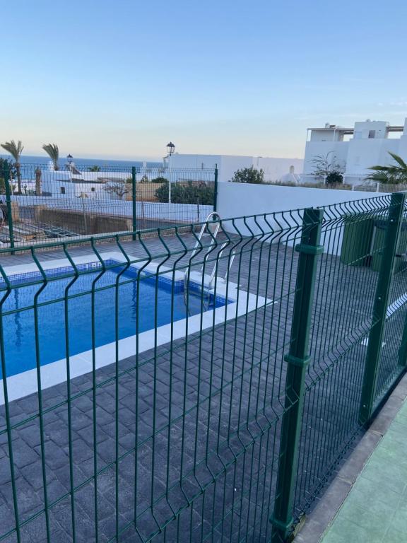 a fence in front of a swimming pool at Mojacar Luxury in Mojácar