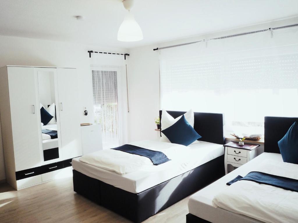 Кровать или кровати в номере Elite Retreat Ferienwohnung