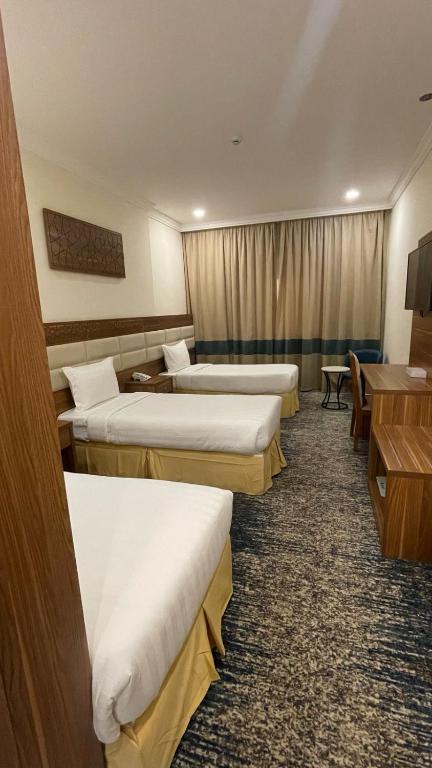 Postel nebo postele na pokoji v ubytování فندق جوري الهدا مكة