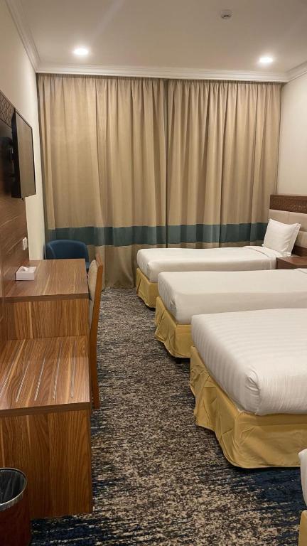 Postel nebo postele na pokoji v ubytování فندق جوري الهدا مكة