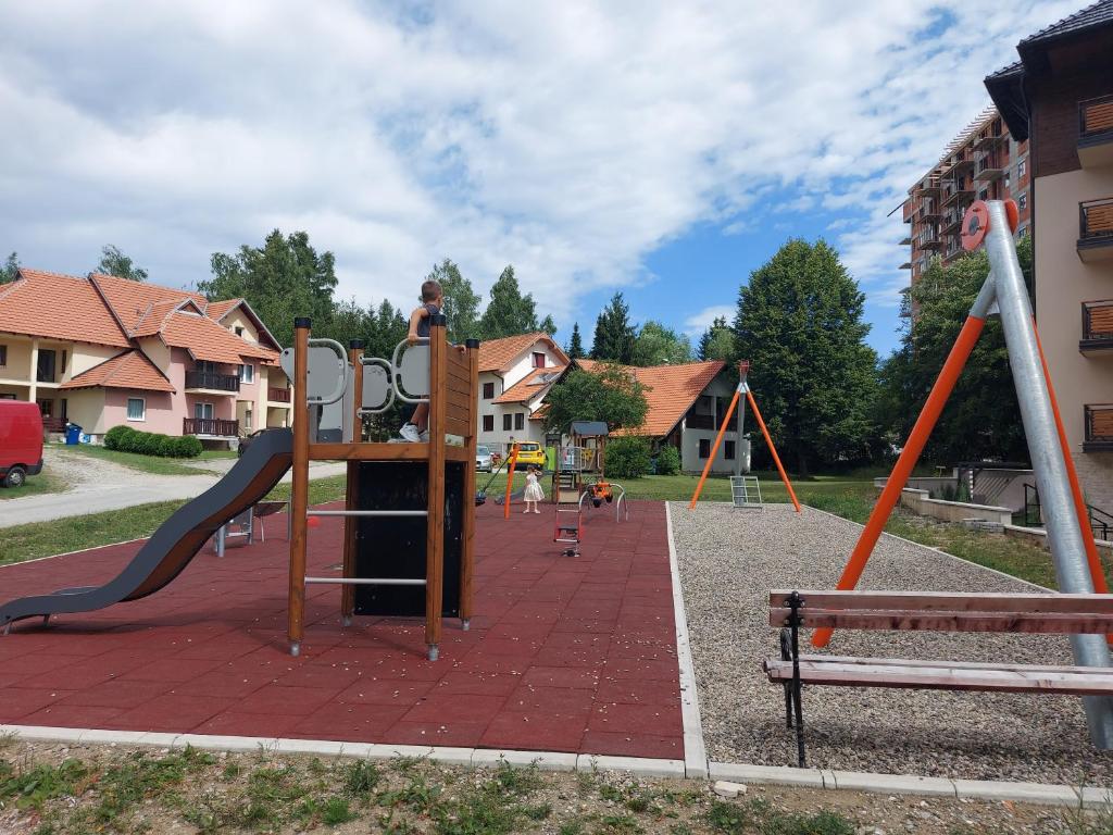 a park with a playground with a slide at Carpe Diem in Zlatibor