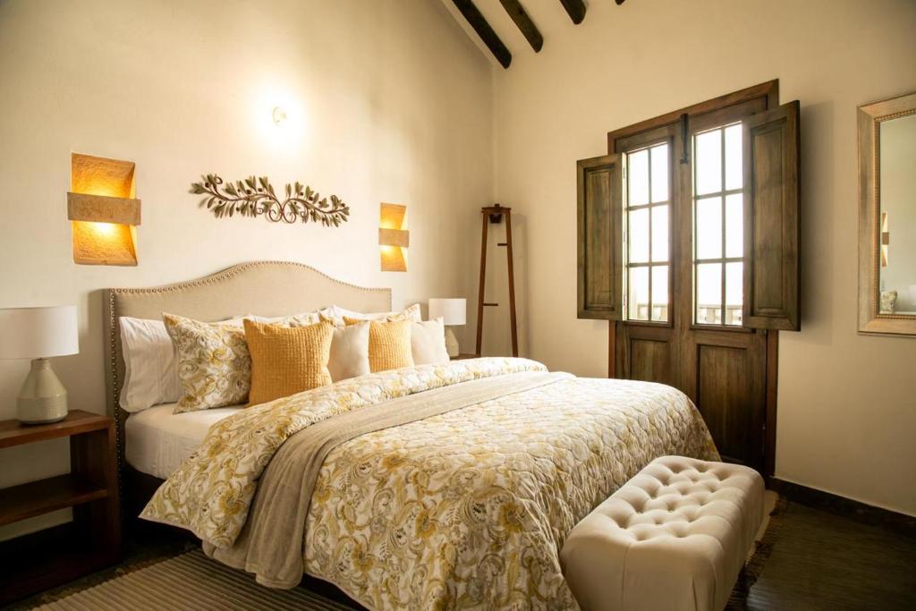 Voodi või voodid majutusasutuse Santa Lucía Casa Hotel toas