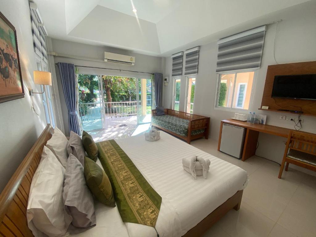 Postel nebo postele na pokoji v ubytování Chang Noi Hua Hin Pranburi fully accessible barrierefrei resort
