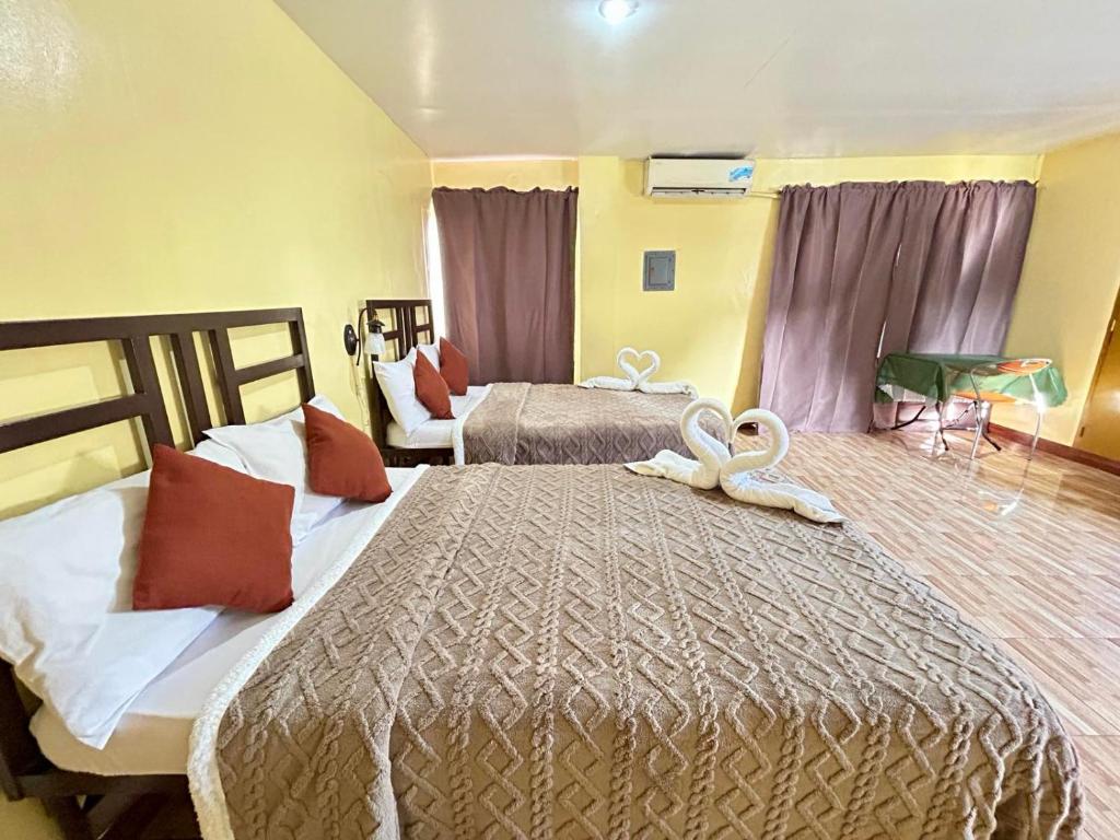 Postel nebo postele na pokoji v ubytování Elegance Guesthouse