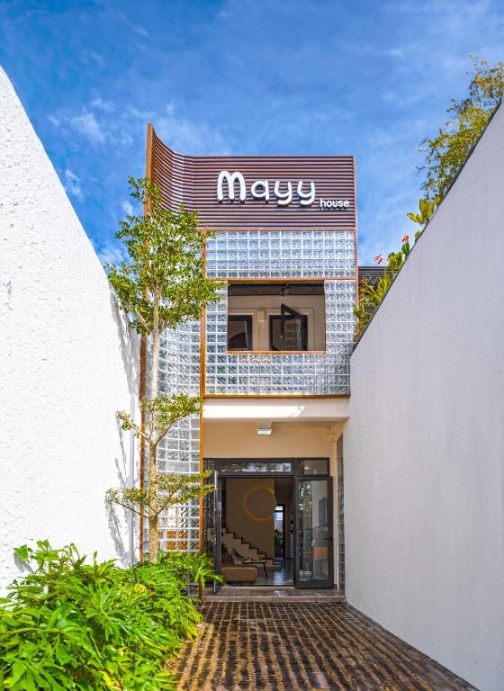 a building with a sign on the side of it at Mayy House Dalat in Da Lat