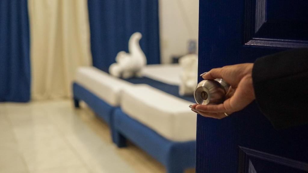 a person opening a door to a hospital room at Lighthouse View Boutique Hotel in Boracay