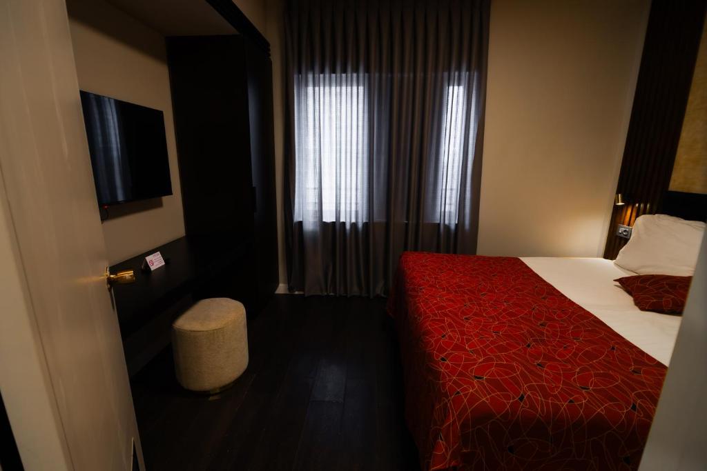 Postel nebo postele na pokoji v ubytování Lev Yerushalayim Hotel