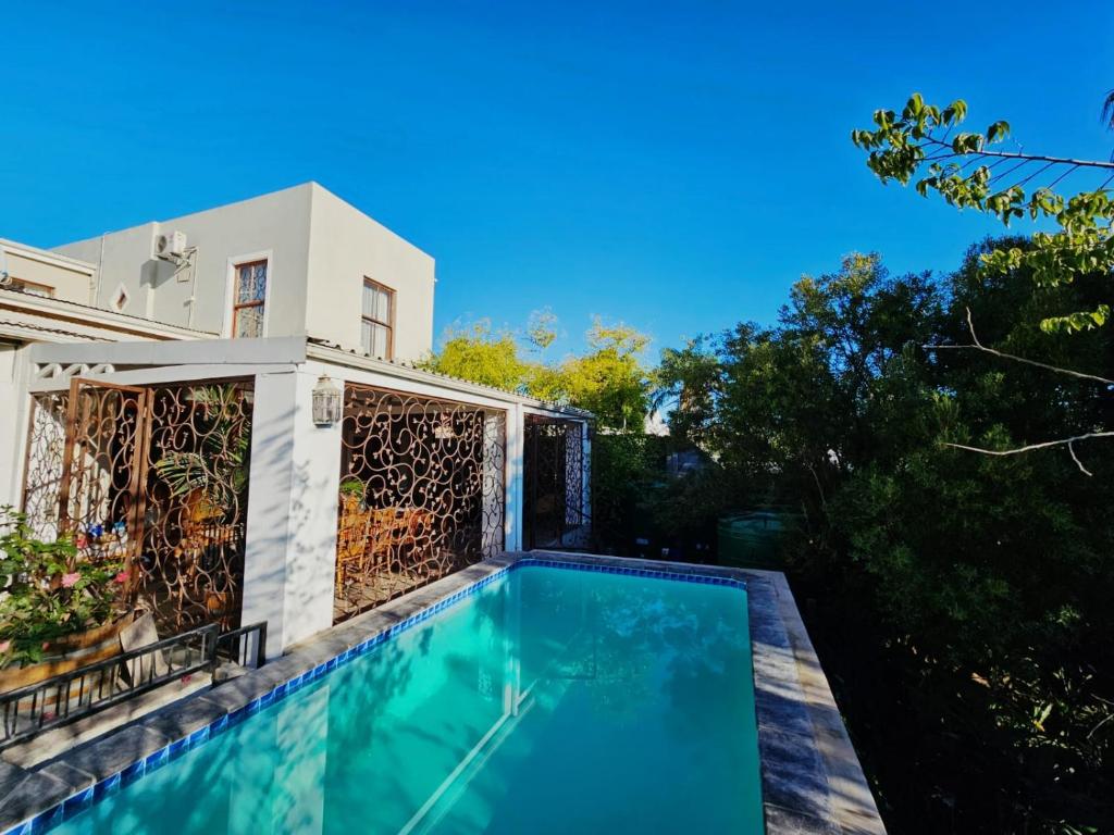 a swimming pool in the backyard of a house at Haus Müller in Clanwilliam